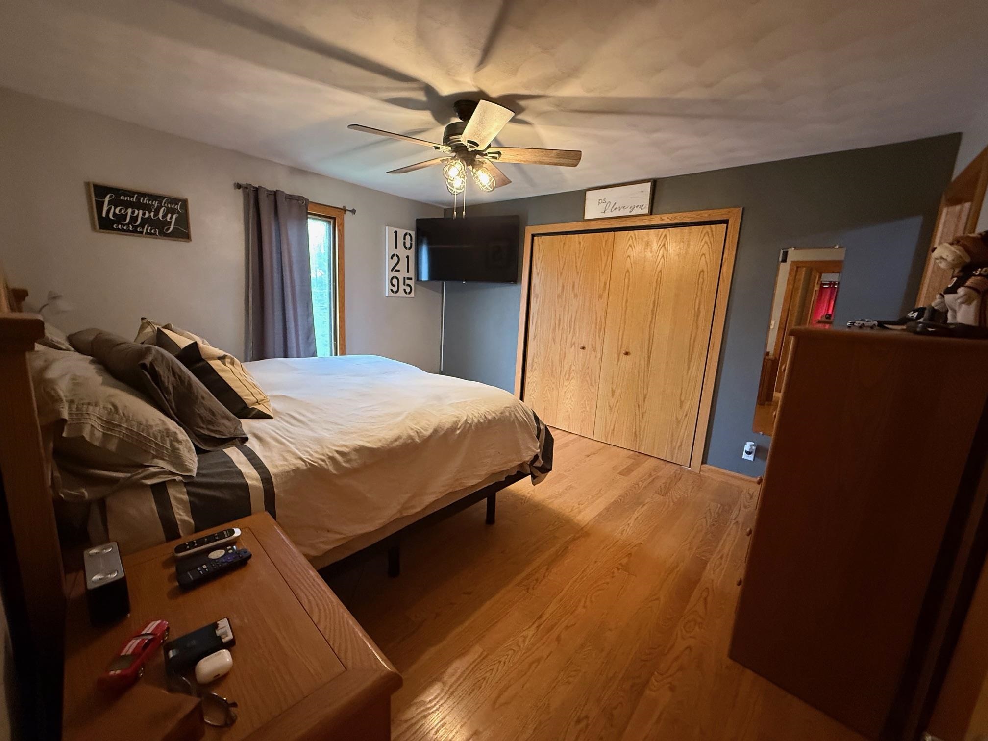 7758 Ray Court Roscoe, IL 61073 - Photo 16 of 37 a bedroom with a bed and a chandelier