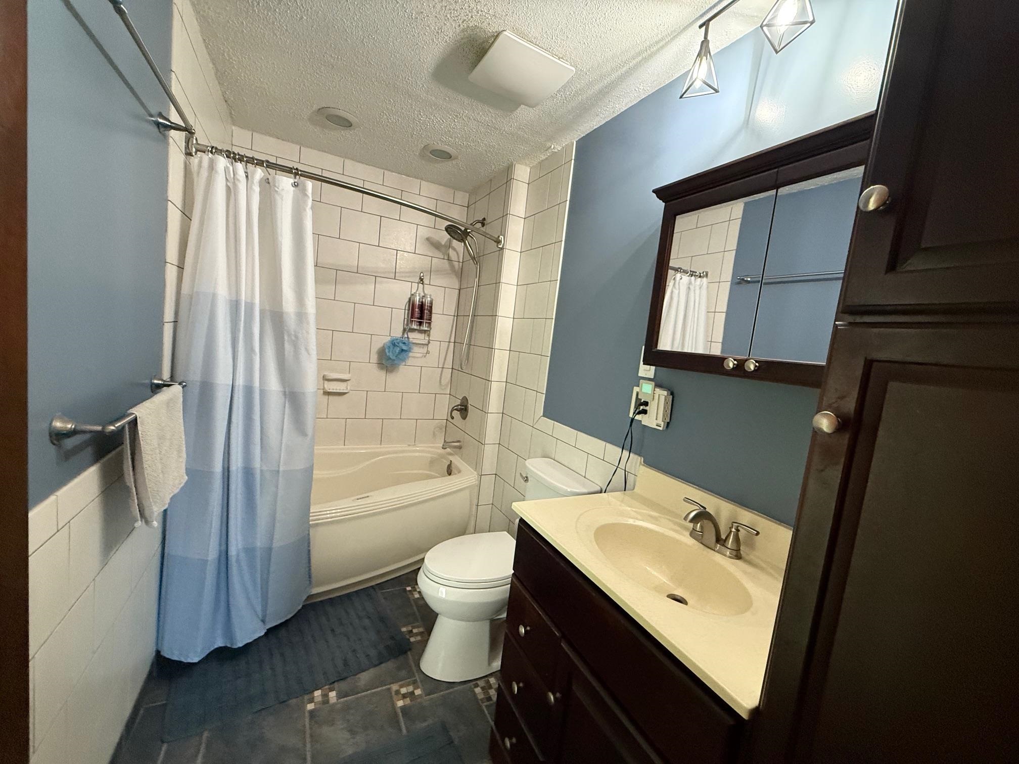 7758 Ray Court Roscoe, IL 61073 - Photo 17 of 37 a bathroom with a sink a toilet and shower