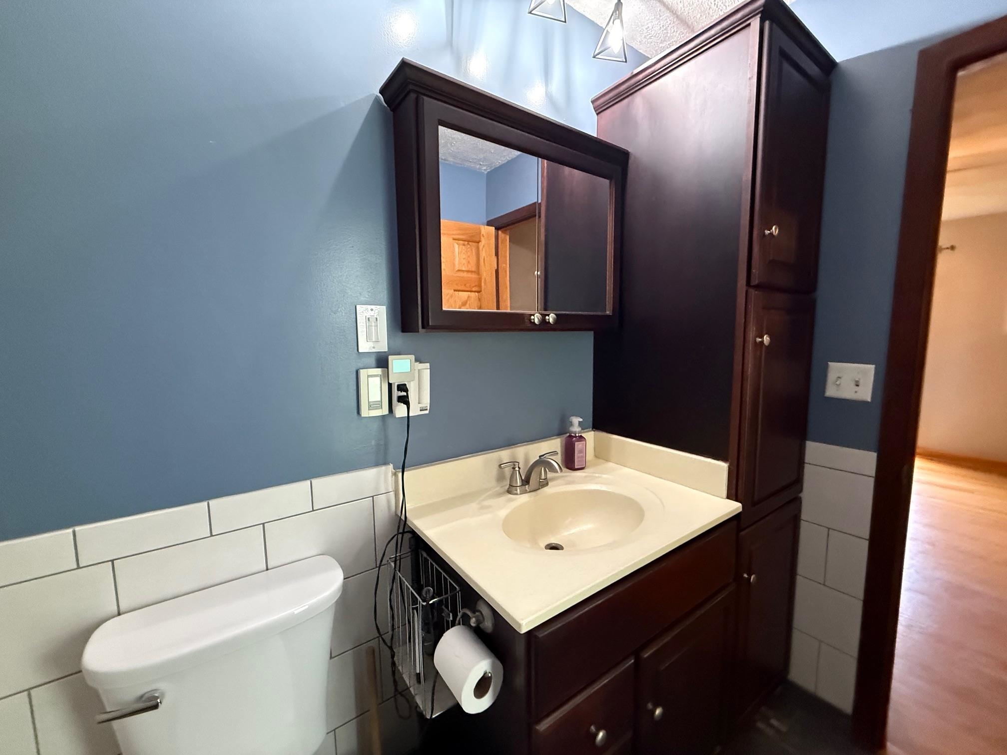 7758 Ray Court Roscoe, IL 61073 - Photo 19 of 37 a bathroom with a sink toilet and mirror