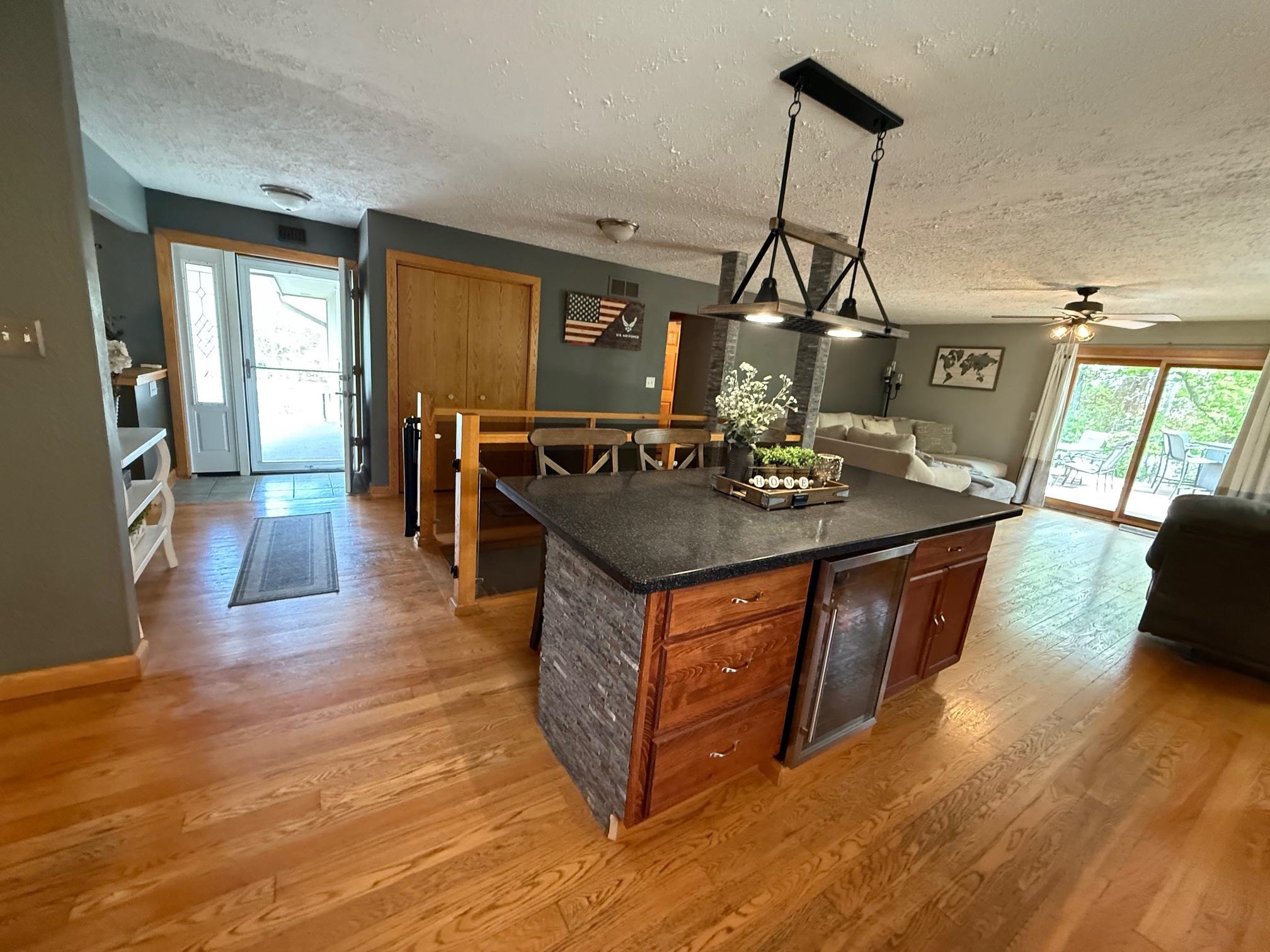 7758 Ray Court Roscoe, IL 61073 - Photo 2 of 37 a living room with dining table and wooden floor