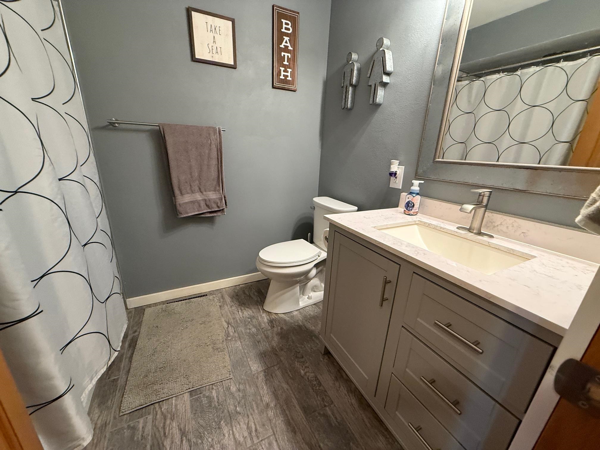 7758 Ray Court Roscoe, IL 61073 - Photo 21 of 37 a bathroom with a sink and a toilet