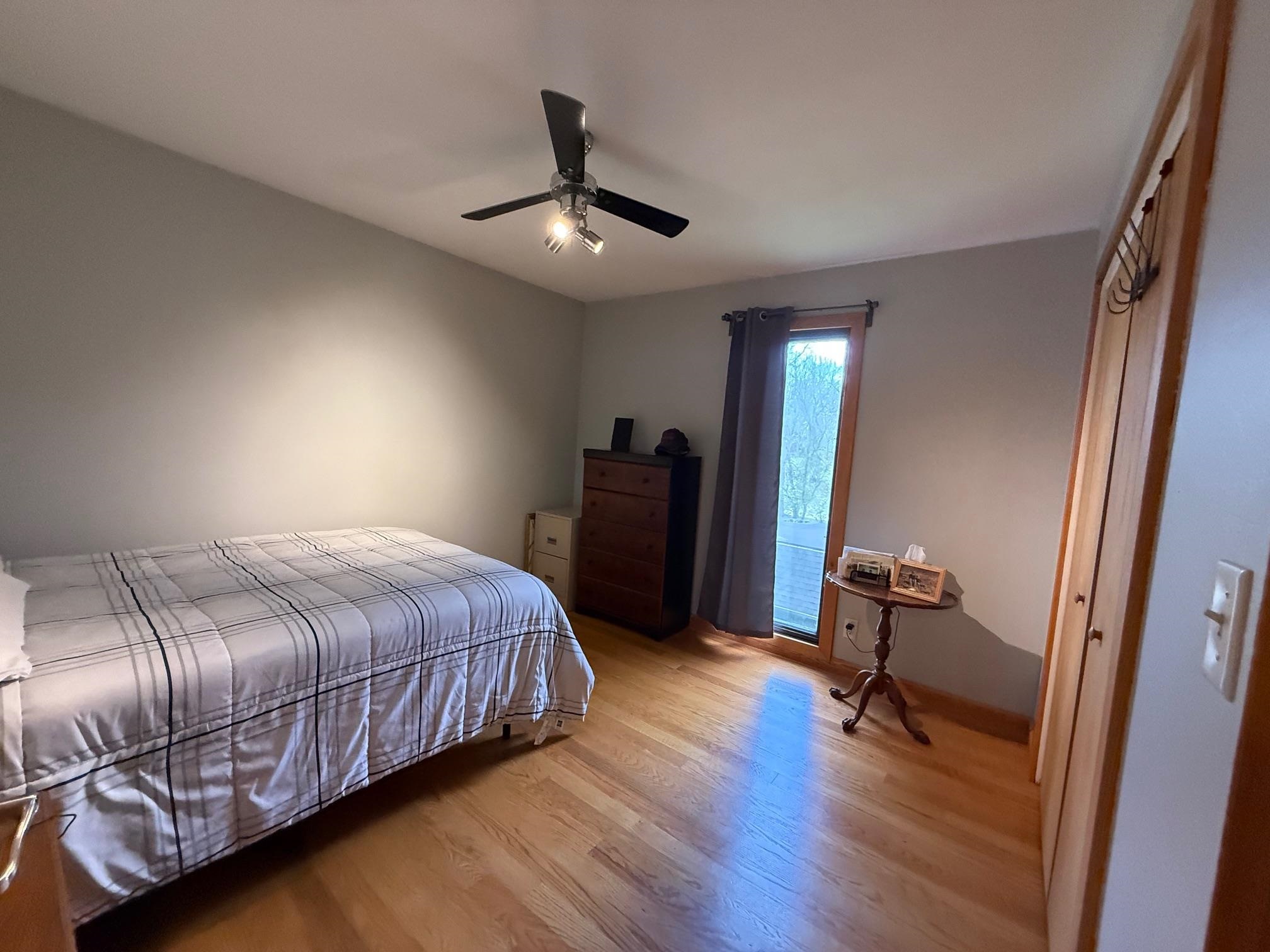 7758 Ray Court Roscoe, IL 61073 - Photo 22 of 37 a bedroom with a bed and a chair