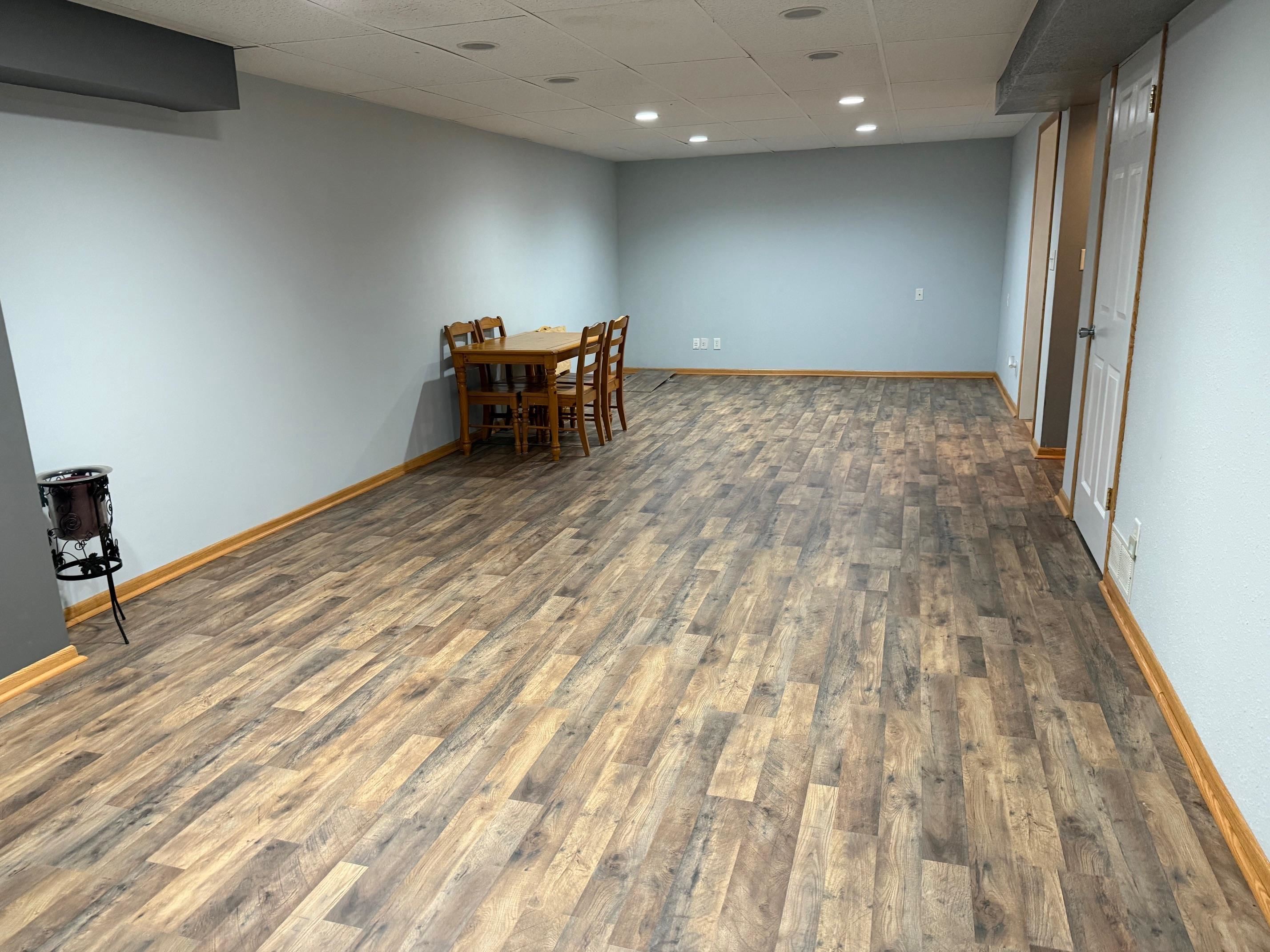7758 Ray Court Roscoe, IL 61073 - Photo 26 of 37 an empty room with wooden floor and furniture