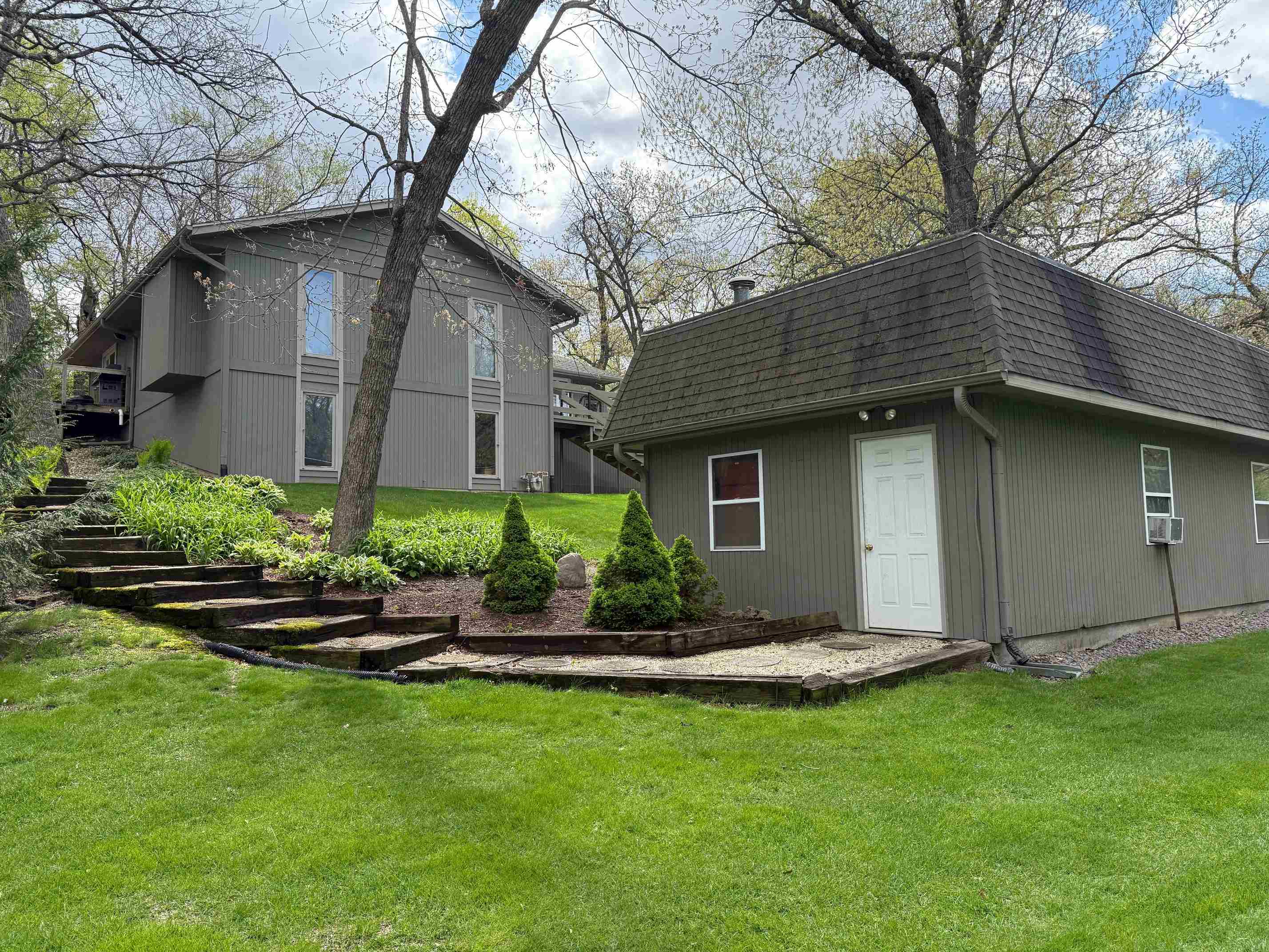 7758 Ray Court Roscoe, IL 61073 - Photo 31 of 37 a view of a house with a yard and plants