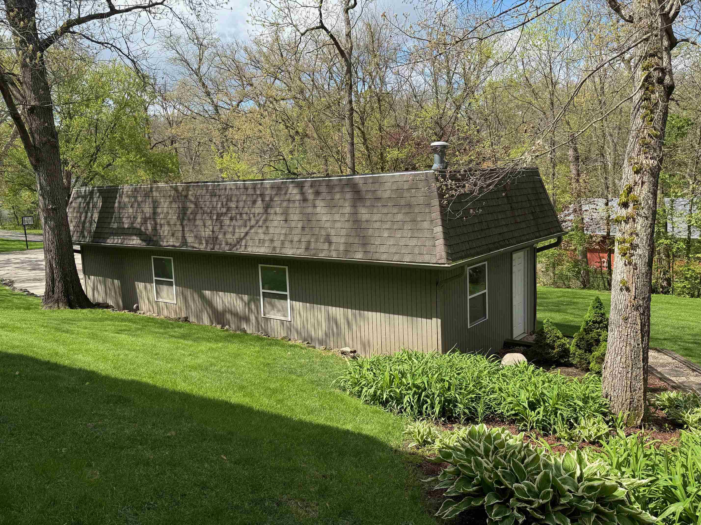 7758 Ray Court Roscoe, IL 61073 - Photo 33 of 37 front view of a house with a garden