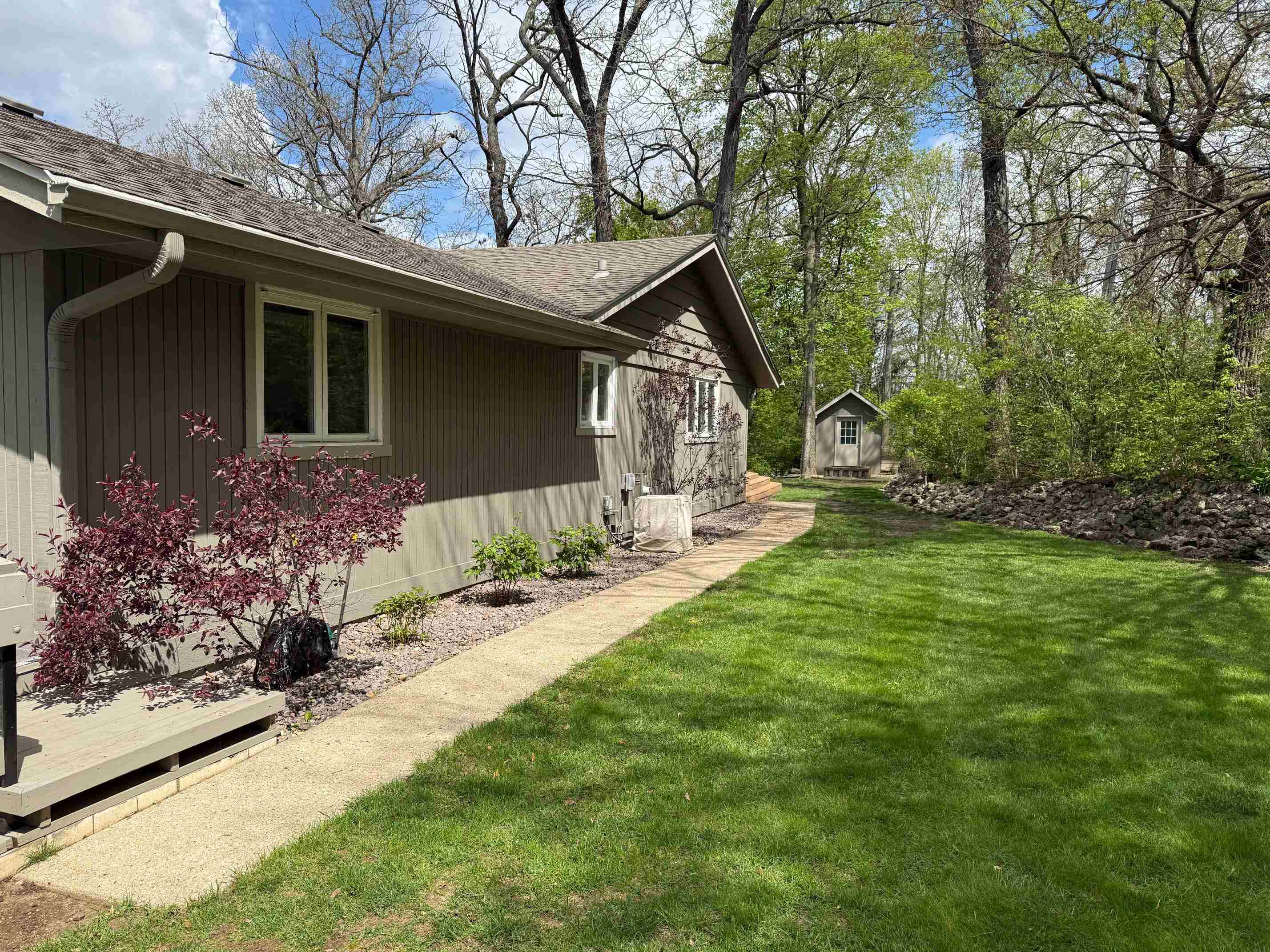 7758 Ray Court Roscoe, IL 61073 - Photo 36 of 37 a front view of house with yard and trees around
