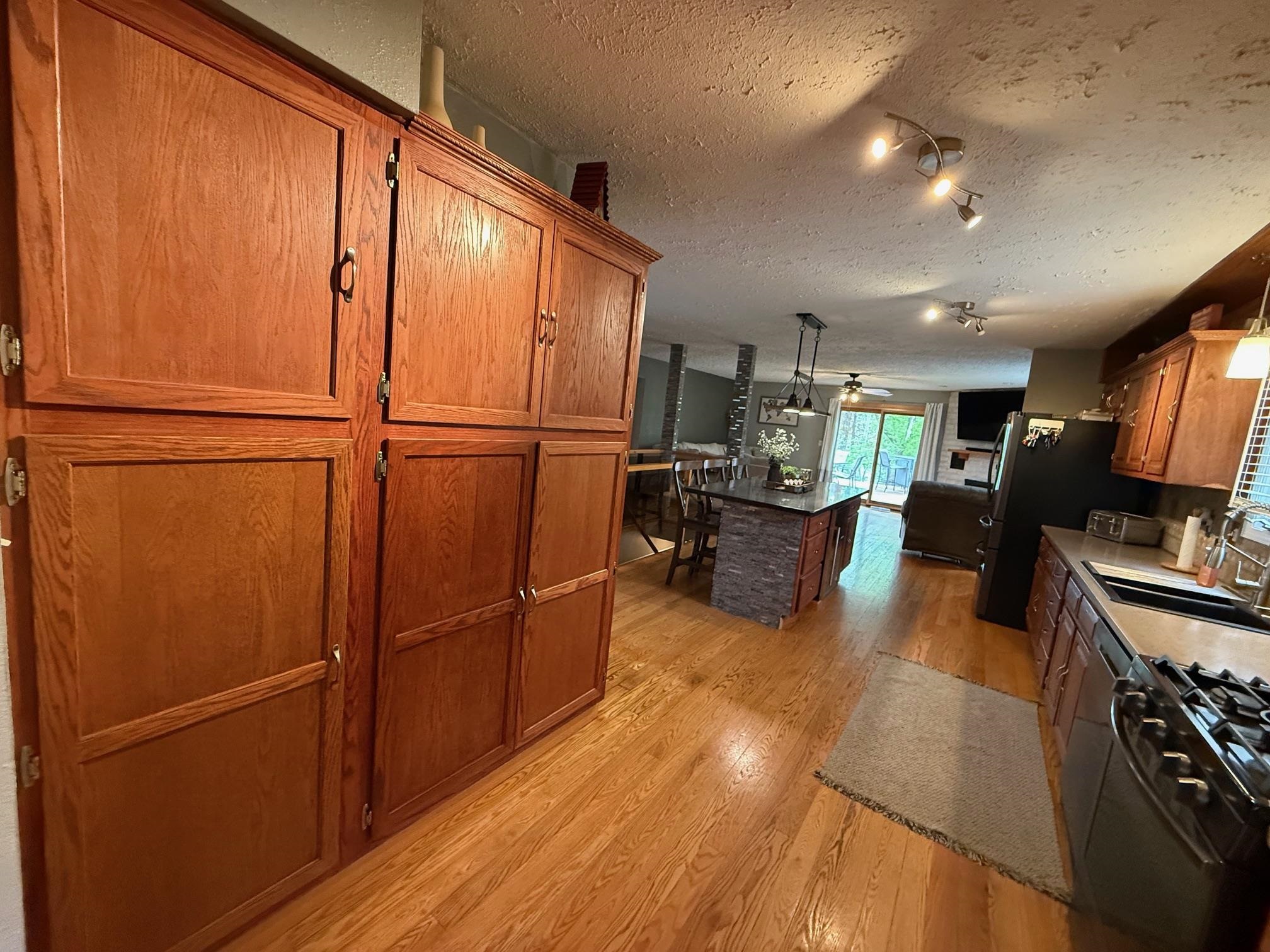 7758 Ray Court Roscoe, IL 61073 - Photo 6 of 37 a view of living room with furniture and a flat screen tv