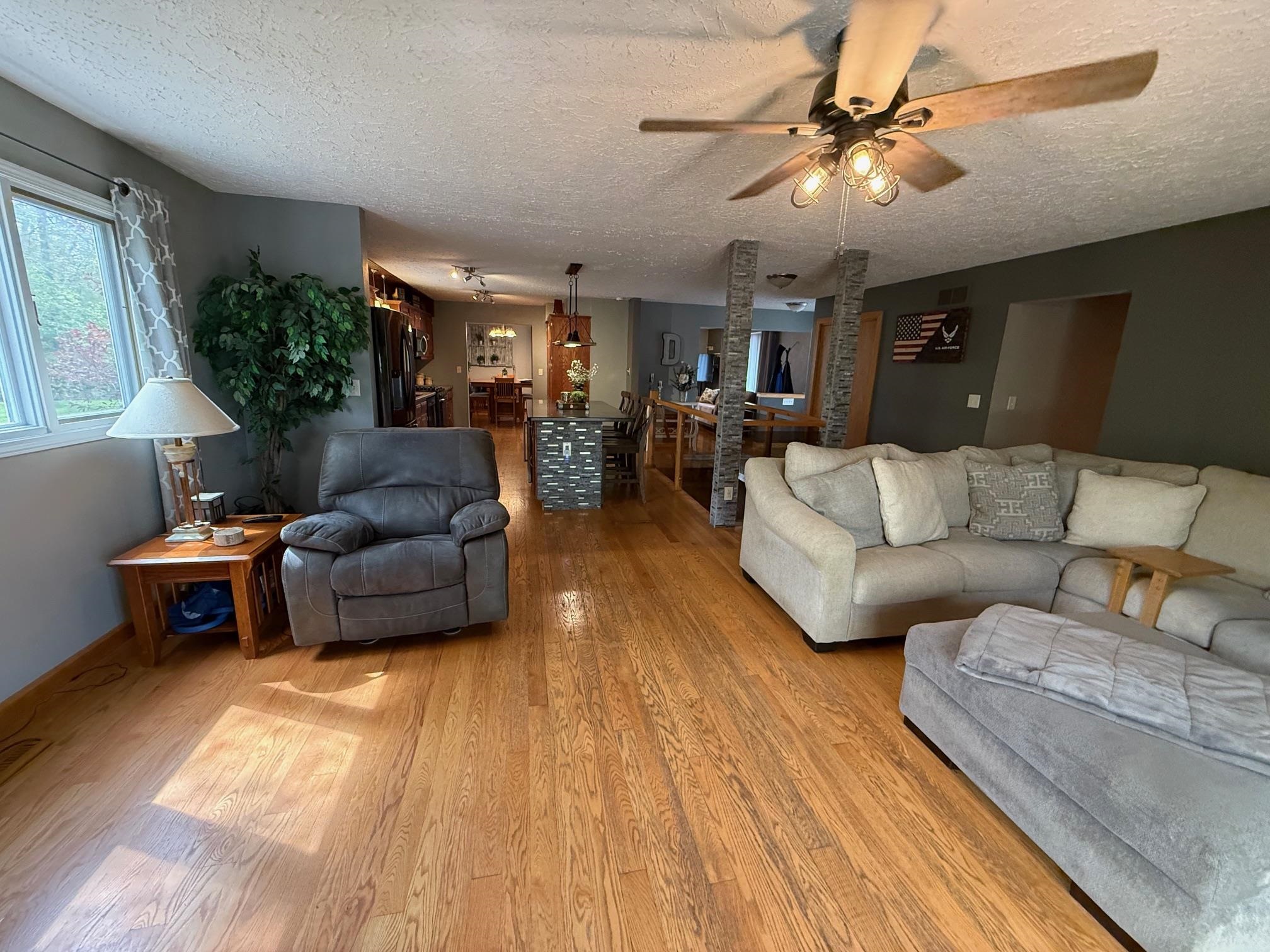 7758 Ray Court Roscoe, IL 61073 - Photo 10 of 37 a living room with furniture and a large window