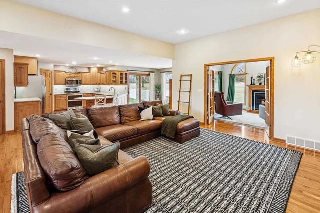 a living room with furniture ceiling fan and a rug