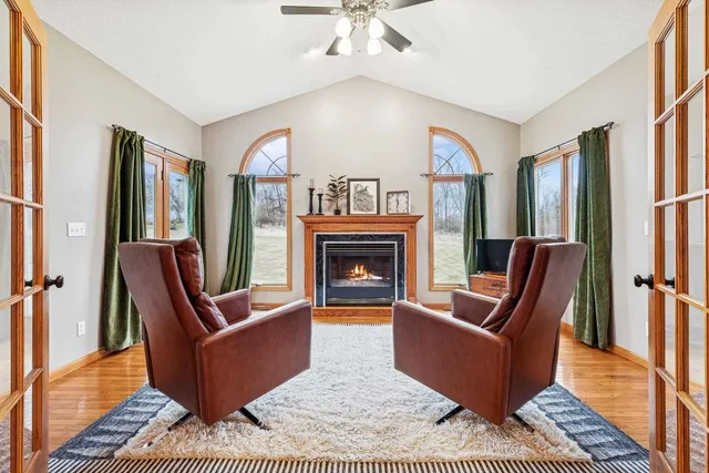 a living room with furniture a rug and a fireplace
