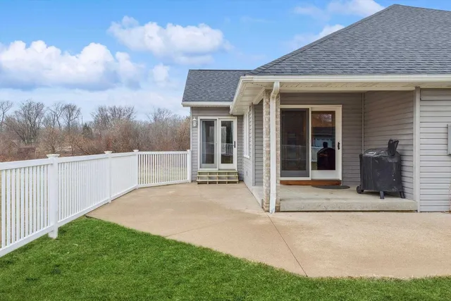 a view of house with backyard and porch