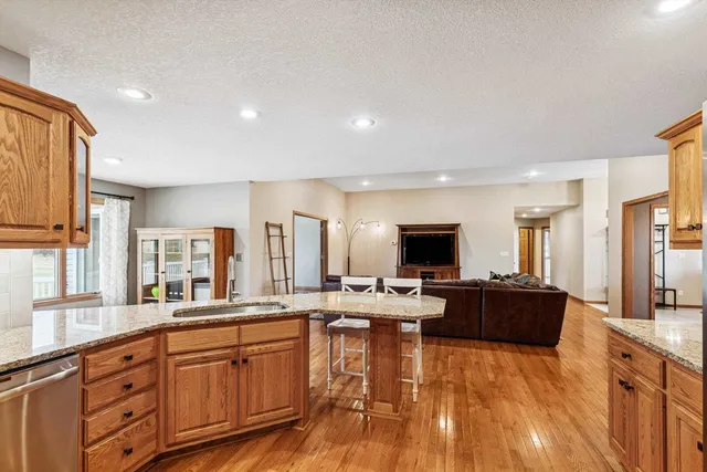 a large kitchen with lots of counter space and stainless steel appliances