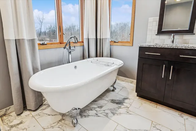a bath room with a sink and a mirror