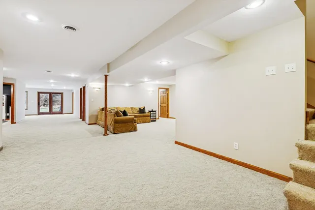 a large room with a bed and a couch