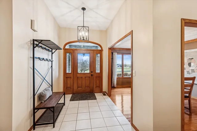 a view of a hallway with a chandelier