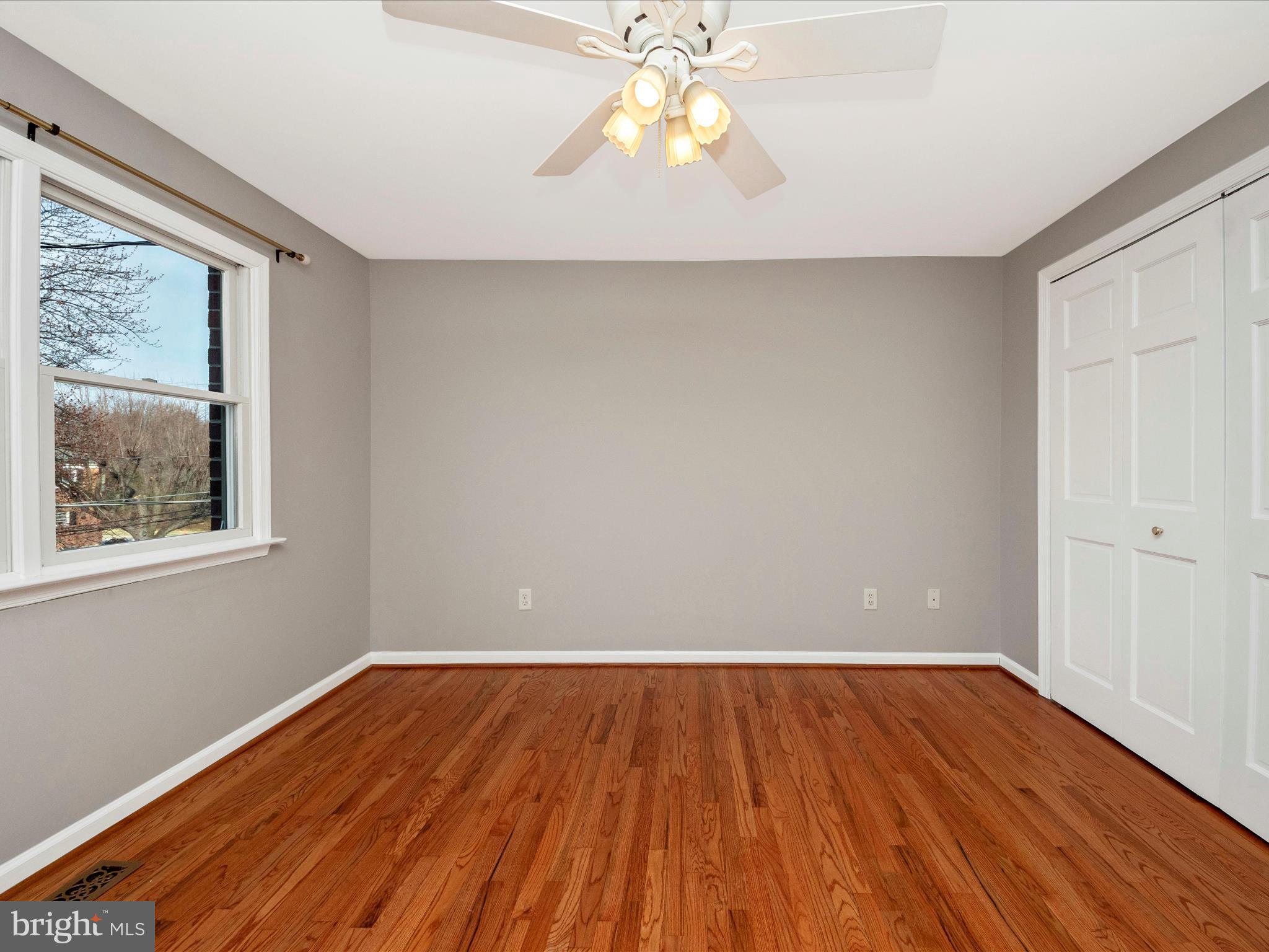 5610 Braxfield Road Halethorpe, MD 21227 - Photo 15 of 32 a view of room with window and wooden floor