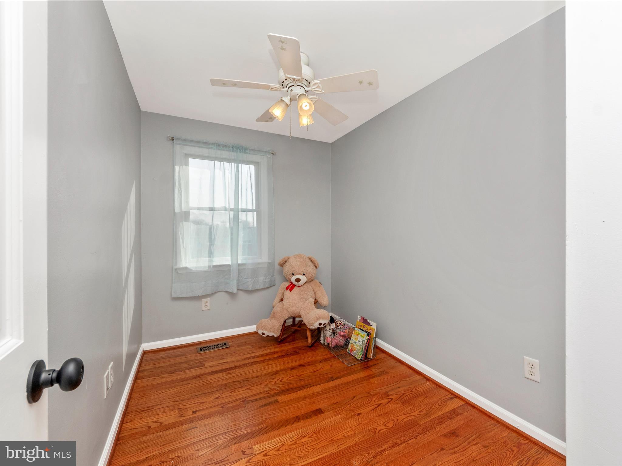 5610 Braxfield Road Halethorpe, MD 21227 - Photo 19 of 32 a bedroom with a bed and window