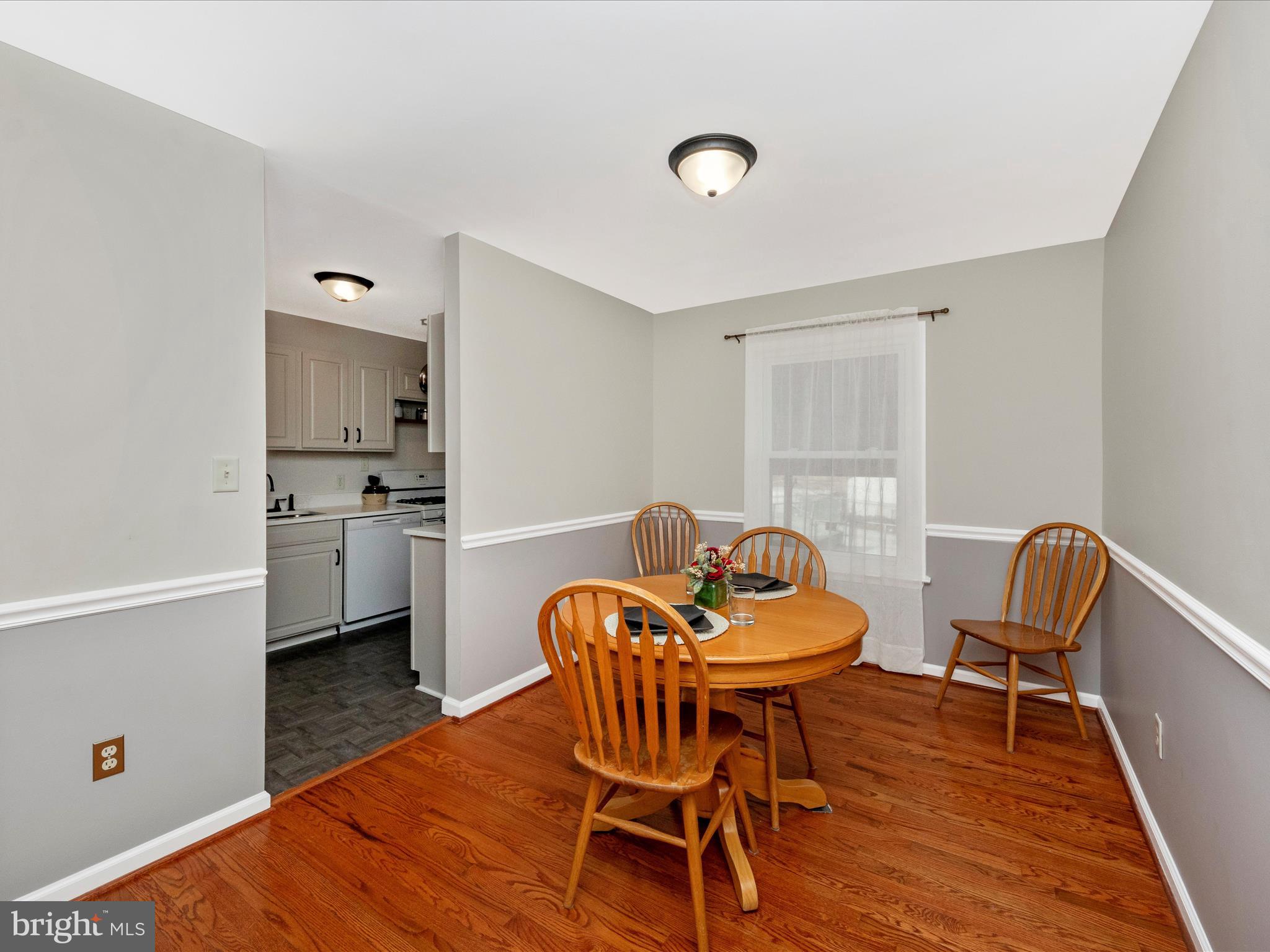 5610 Braxfield Road Halethorpe, MD 21227 - Photo 5 of 32 a dining room with furniture and wooden floor