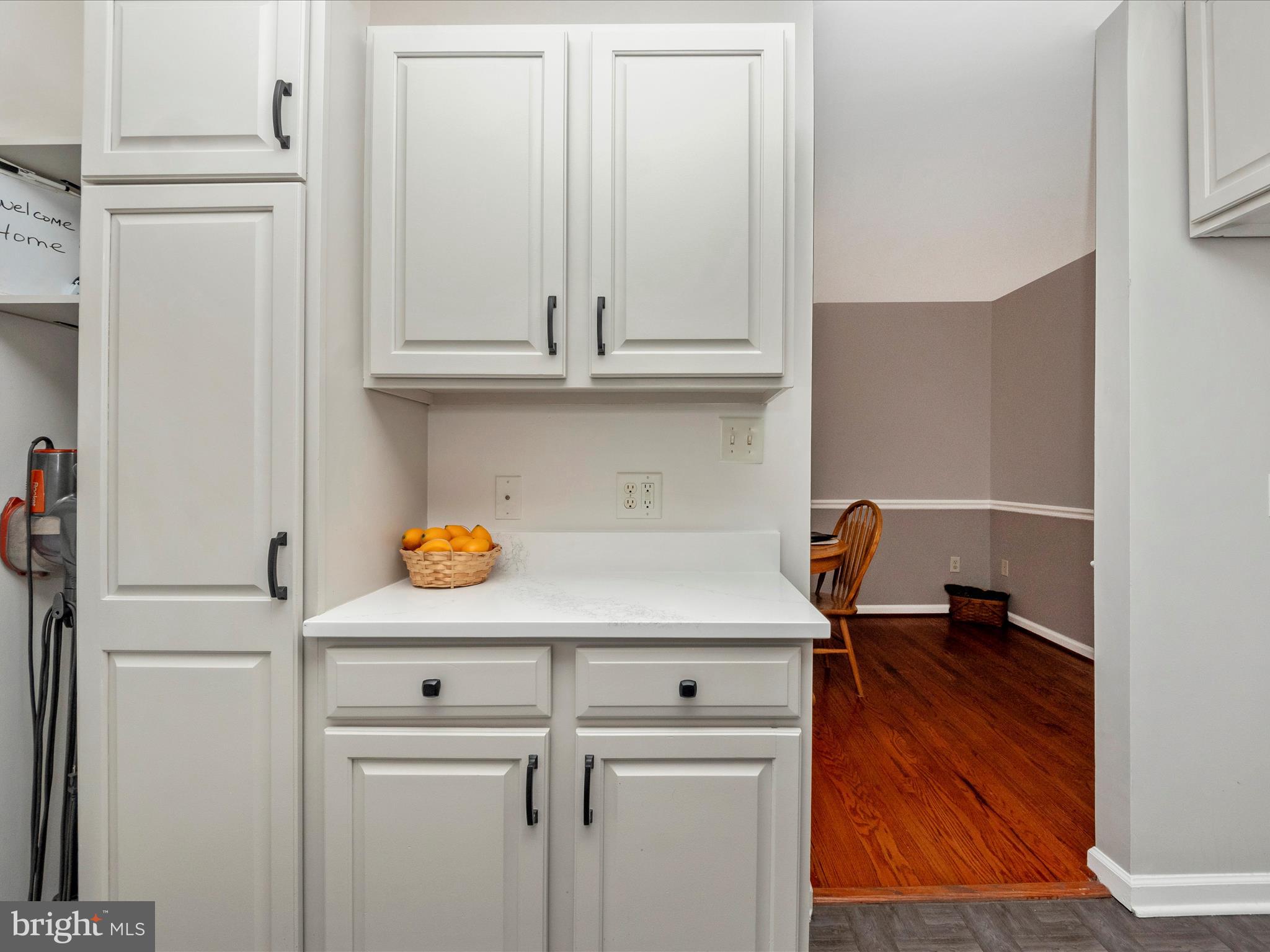 5610 Braxfield Road Halethorpe, MD 21227 - Photo 10 of 32 a view of washer and dryer with wooden floor