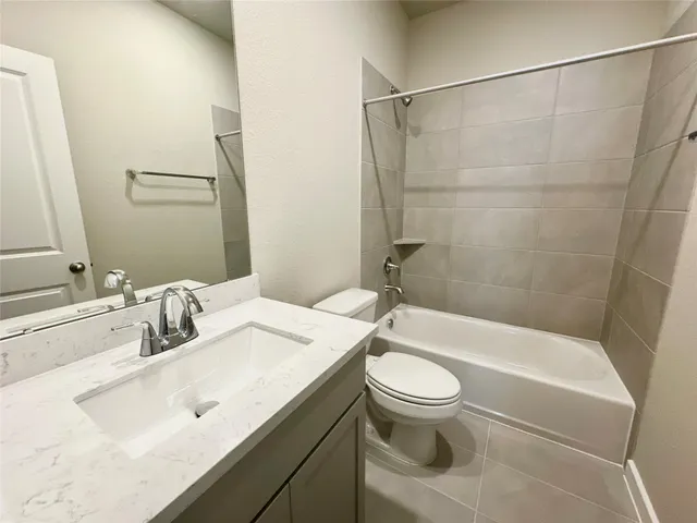 a bathroom with a sink a toilet and a bathtub