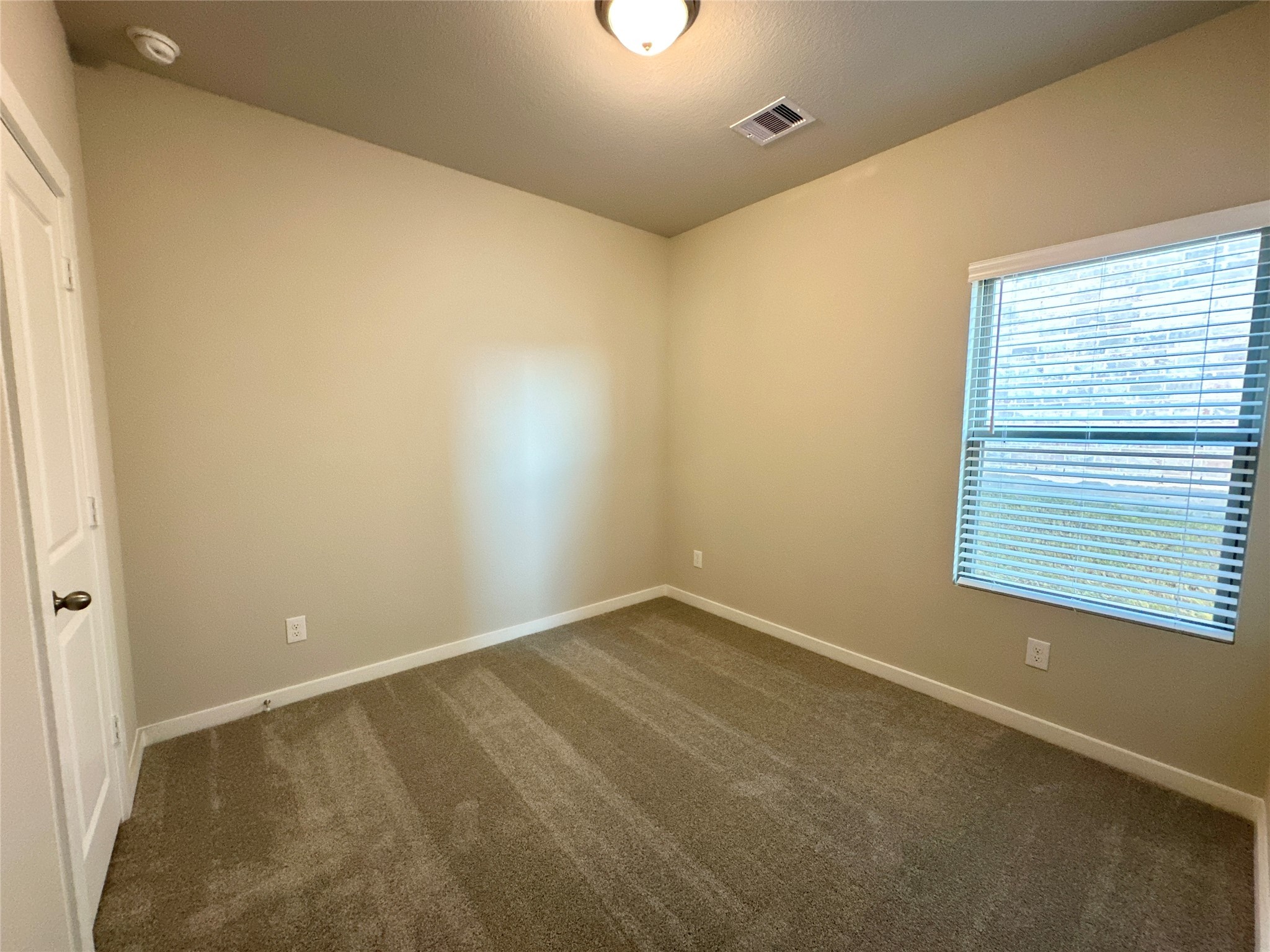 12194 Ridge Top Drive Conroe, TX 77304 - Photo 18 of 33 a view of an empty room with a window