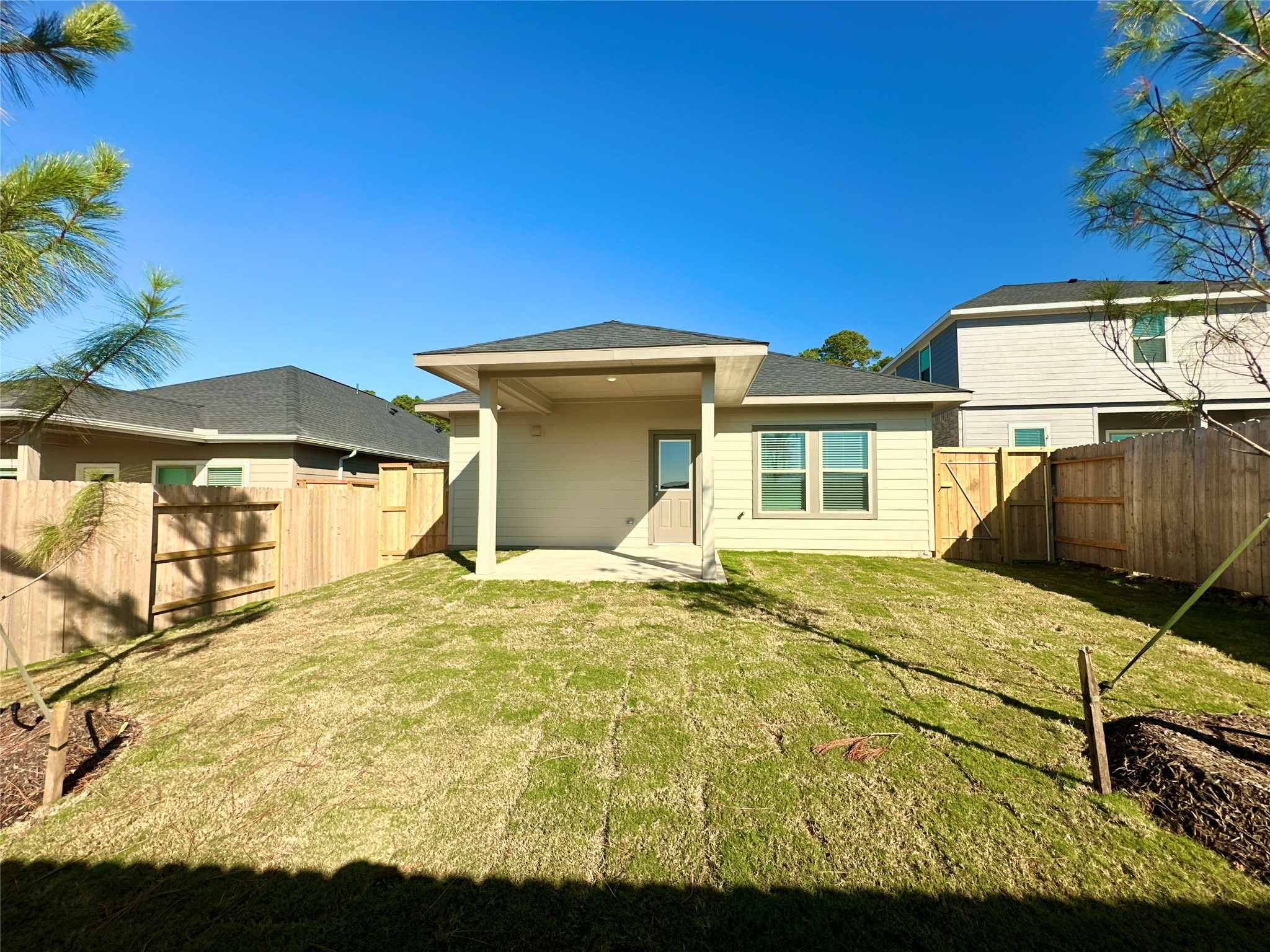 12194 Ridge Top Drive Conroe, TX 77304 - Photo 23 of 33 a view of an house with backyard space