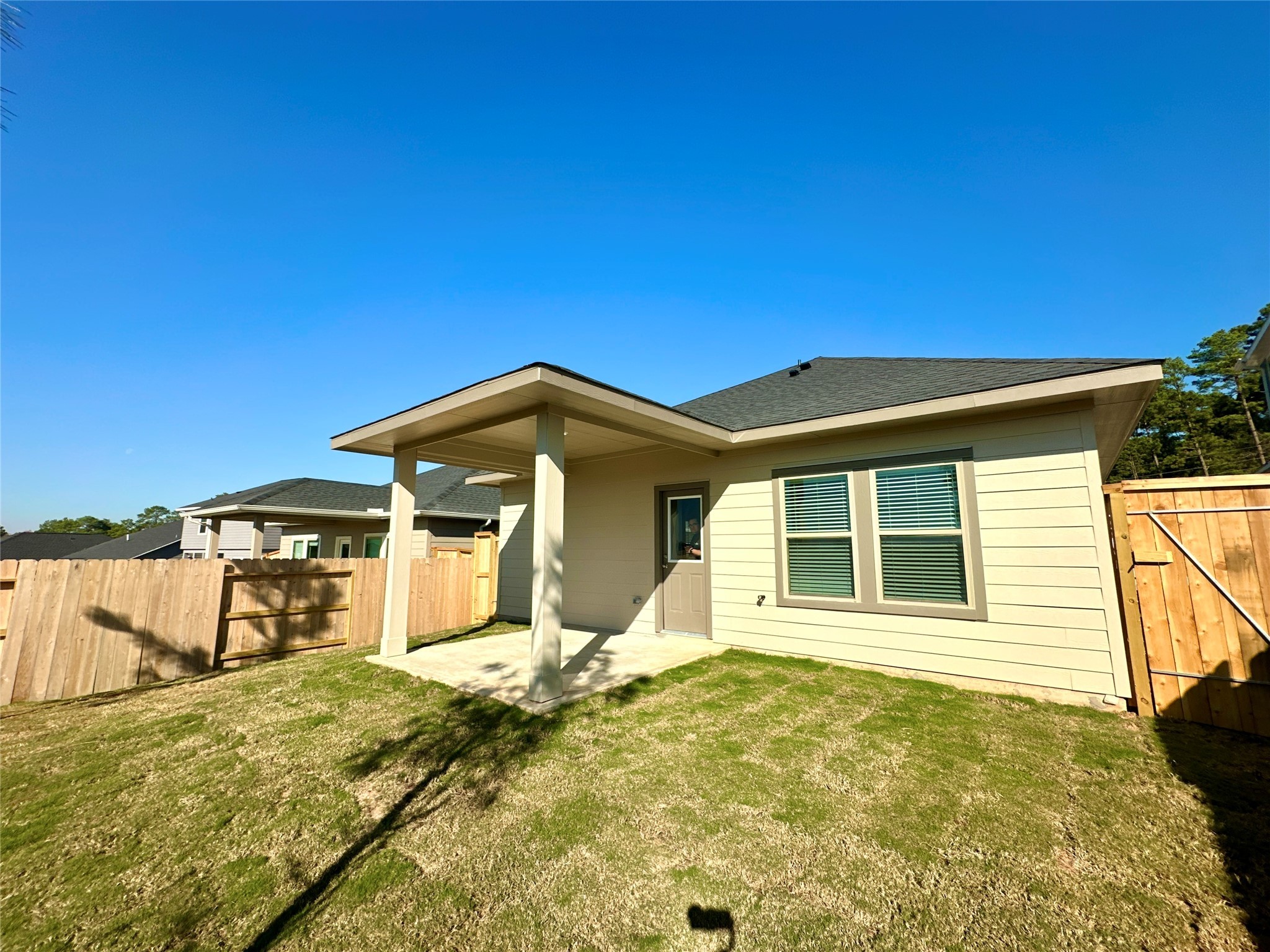 12194 Ridge Top Drive Conroe, TX 77304 - Photo 24 of 33 a front view of a house with a yard