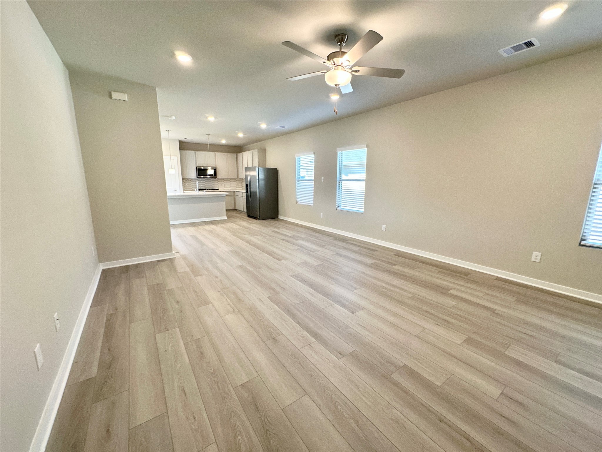 12194 Ridge Top Drive Conroe, TX 77304 - Photo 9 of 33 wooden floor in an empty room with a window