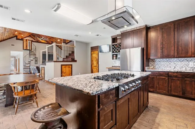 a kitchen with a sink and a refrigerator