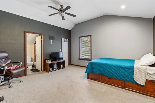 a bathroom with a sink toilet and a mirror