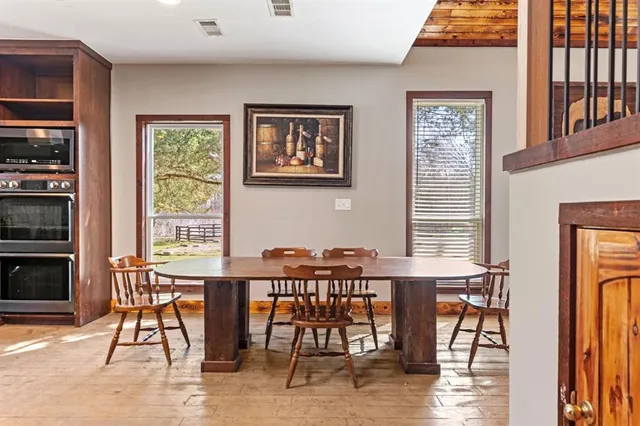 a kitchen with a sink appliances and cabinets