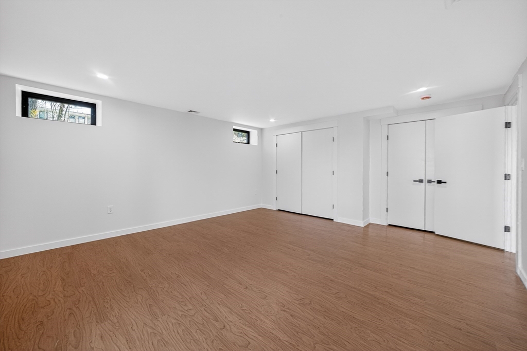 15 Bird Hill Road Lexington, MA 02421 - Photo 30 of 34 a view of an empty room with wooden floor