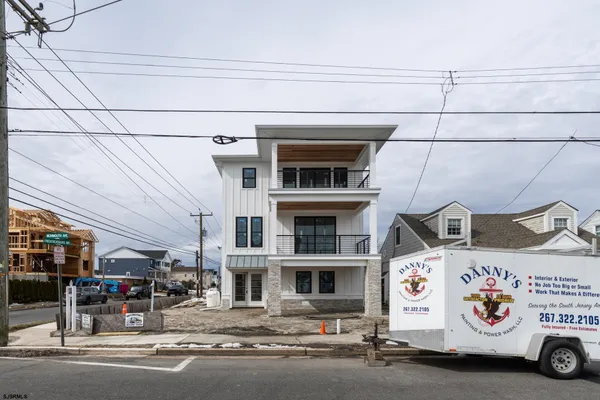 a front view of a building with garage
