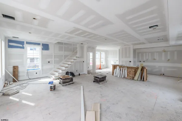 a very nice looking room with a large window and couch