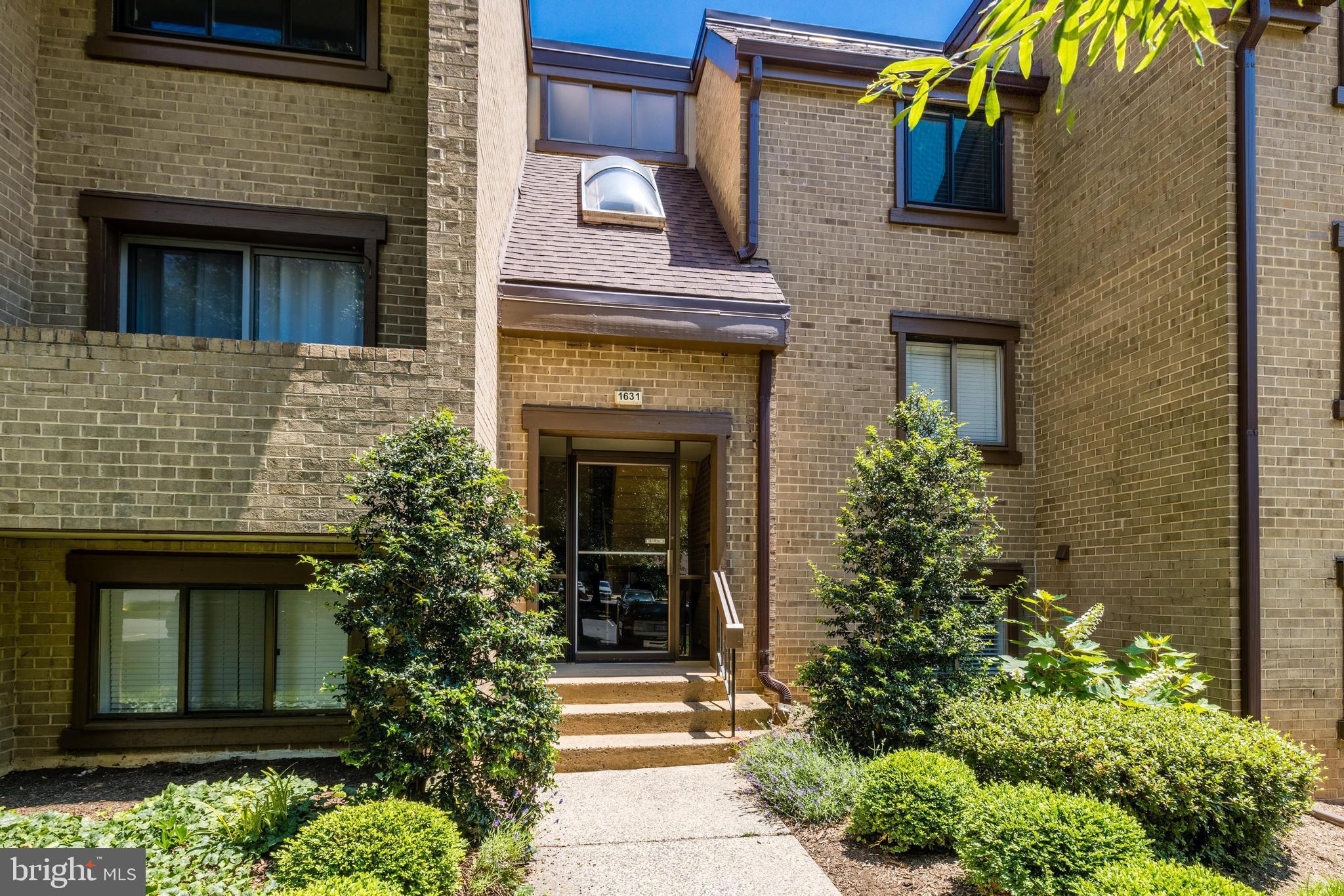 1631 Parkcrest Circle, Unit 8B/101 Reston, VA 20190 - Photo 1 of 27 a front view of a house with plants