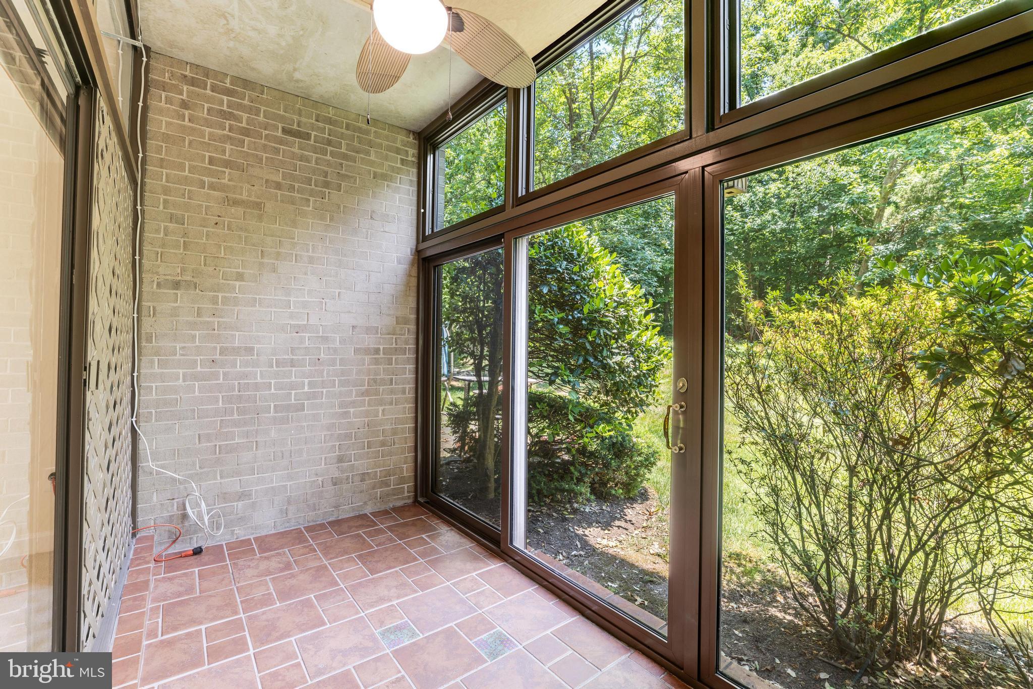 1631 Parkcrest Circle, Unit 8B/101 Reston, VA 20190 - Photo 25 of 27 Sunroom with ceiling fan and light