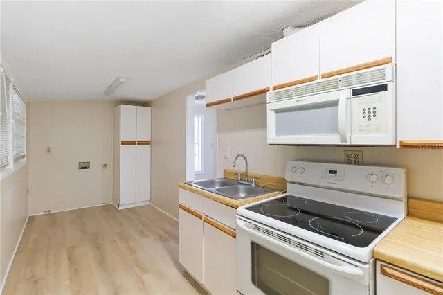 a kitchen with a stove and a sink