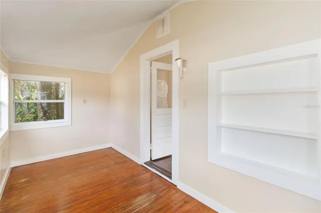 a view of a room that has a bed in it