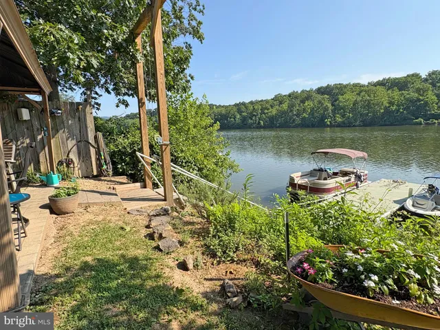 a lake view with a bench