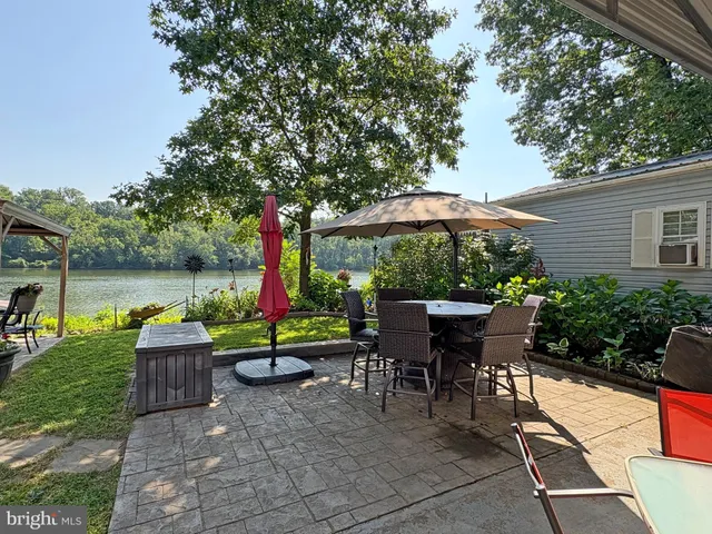 an outdoor space with garden and furniture