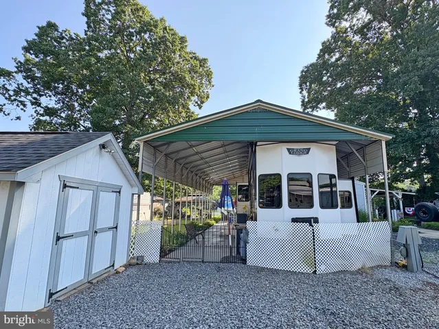 a view of a house with a backyard and porch