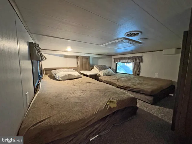 a bathroom with a sink mirror and shower