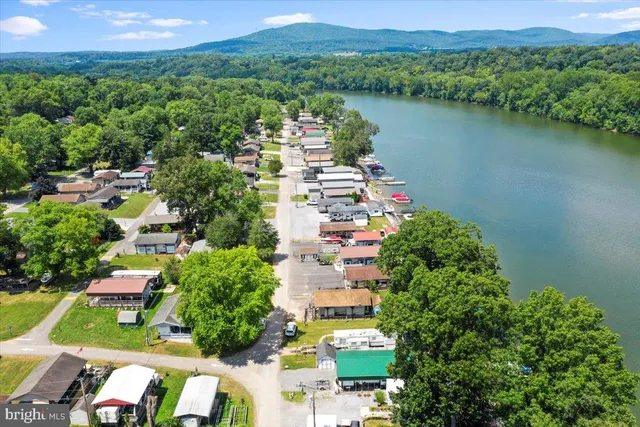 an aerial view of a houses with a yard