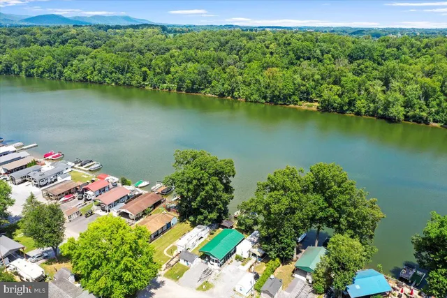 an aerial view of a houses a lake view
