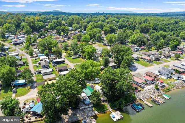 an aerial view of residential house with outdoor space and swimming pool