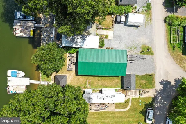 an aerial view of a house with a swimming pool