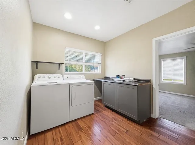 a utility room with washer and dryer