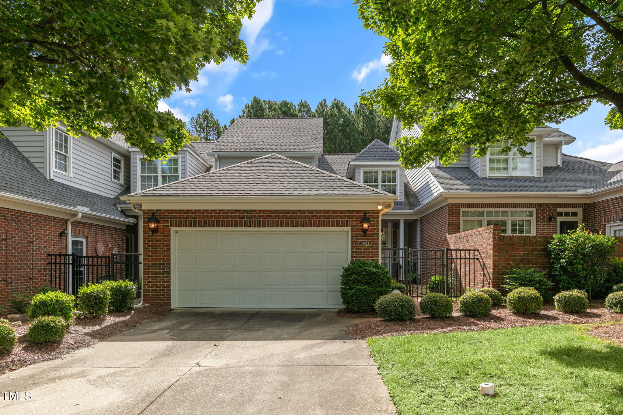 3421 Barron Berkeley Way Raleigh, NC 27612 - Photo 1 of 48 a front view of a house with a garden