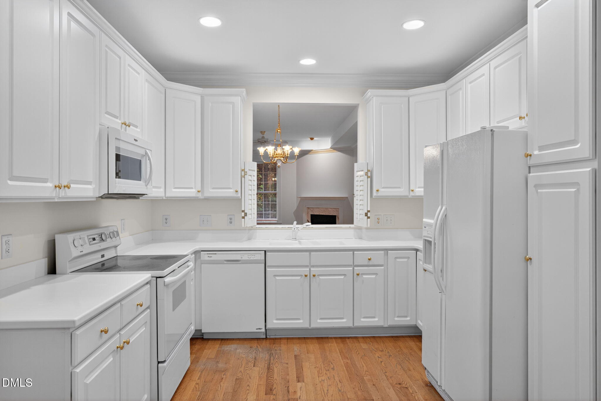 3421 Barron Berkeley Way Raleigh, NC 27612 - Photo 11 of 48 a kitchen with white cabinets and refrigerator