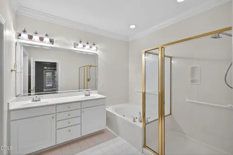 a spacious bathroom with a double vanity sink mirror double and bathtub